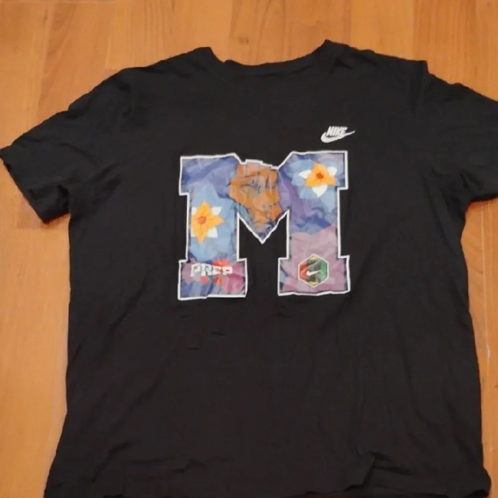 Nike Black T-Shirt with Colorful M Graphic